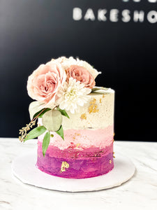 Size: 6" one tier; Icing exterior: white to magenta.