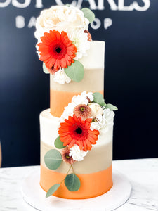 Size 4-6" two tier. Icing exterior: ombre white, tan, orange.