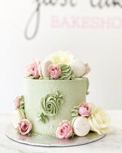 Load image into Gallery viewer, Size: 6&quot; one tier. Icing exterior: sage green. Accent: white/pink
