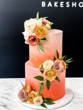 Load image into Gallery viewer, Size: 6-8&quot; two tier. Icing exterior: ombre light peach to orange to red.
