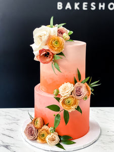 Size: 6-8" two tier. Icing exterior: ombre light peach to orange to red.