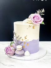 Load image into Gallery viewer, Size: 6&quot; one tier. Icing exterior: white. Accents: gold, purple, white.
