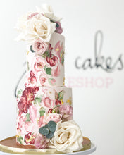 Load image into Gallery viewer, Size: 4-6&quot; two tier. Icing exterior: pale pink. Accents: dark red, greenery. 
